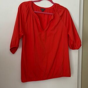 Lilla P orange colored top. Size large